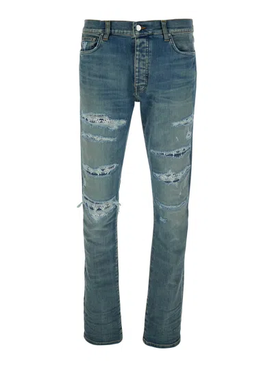 AMIRI AMIRI MEN BLUE 'MA QUAND' JEANS WITH RIPPED DETAILS ON THE FRONT AND LOGO PATCH ON THE REAR IN DENIM