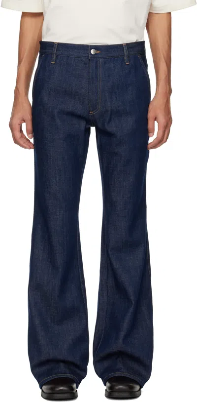 Amiri Raw Boot Cut Jeans In Blue