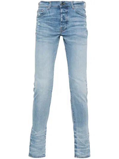 Amiri Stack Skinny Jeans In Blue