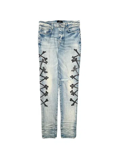 Amiri Bones-motif Jeans In Blue