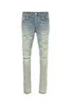Amiri Distressed Stretch Denim Jeans With Faded Effect