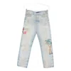Amiri Distressed Embroidered Denim Trousers In Blue