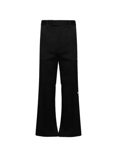 Amiri Creased Flared Wool Pants In Black