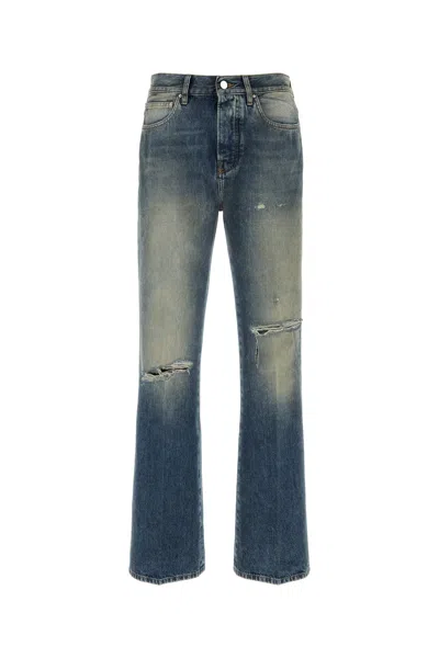 Amiri Blue Jeans With Rips On The Front And Logo Patch On The Back In Cotton Man