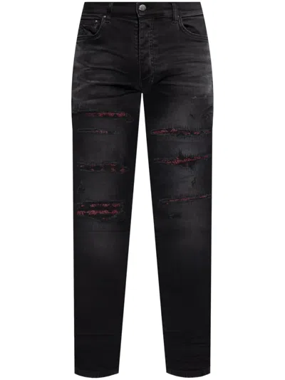 AMIRI DISTRESSED BANDANA-DETAIL JEANS