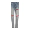 Amiri Mx1 Slim Fit Jeans With Distressed Red Accents