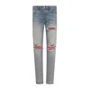 Amiri Mx1 Slim Fit Jeans With Distressed Red Accents