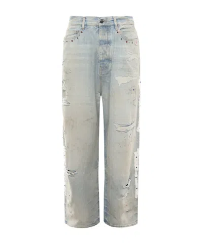 Amiri Distressed Bones Studded Baggy Jeans In Blue