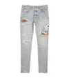Amiri Distressed Cement Thrasher Skinny Jeans In Gray