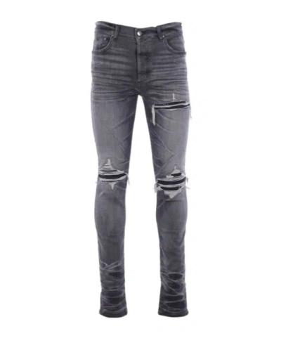 AMIRI AMIRI DISTRESSED SKINNY JEANS