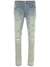 Amiri Distressed Stretch Denim Jeans With Faded Effect In Blau
