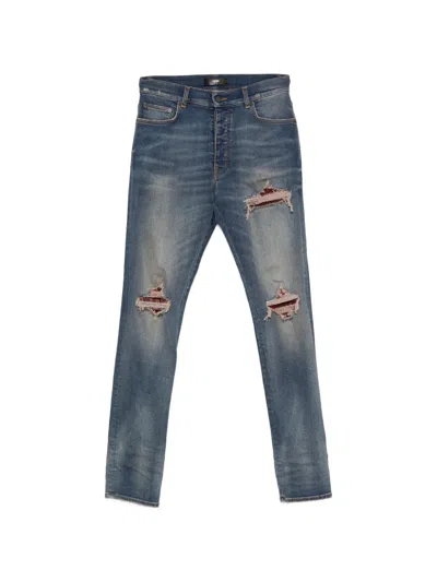 Amiri Distressed Patchwork Jeans In Blue