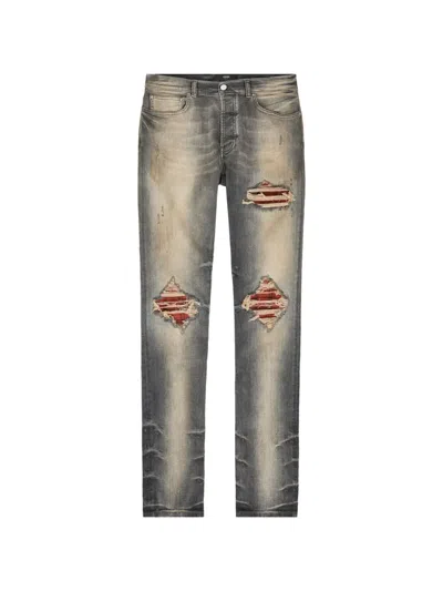 Amiri Distressed Patchwork Jeans In Gray