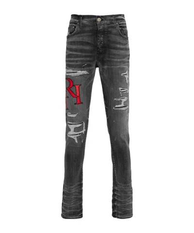 AMIRI DISTRESSED SKINNY JEANS