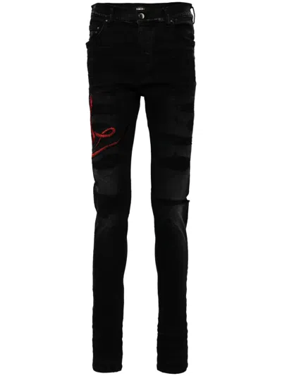 AMIRI DISTRESSED SKINNY JEANS