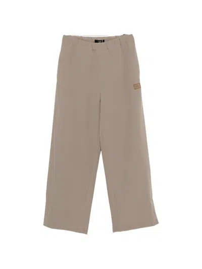 Amiri Elasticated-waistband Logo-patch Trousers In Neutral