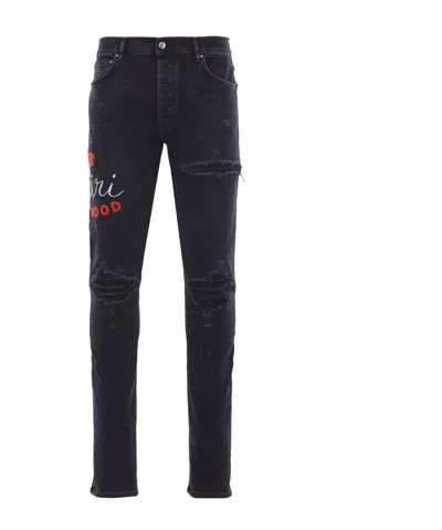 AMIRI EMBROIDERED DISTRESSED JEANS