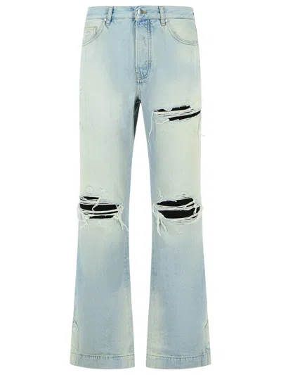 Amiri Men Light Bliue Jeans With Flared Leg And Ripped Details In Denim Man In Blue