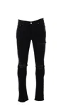 Amiri Slim Fit Distressed Trousers With Rivet Detailing