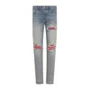 Amiri Mx1 Slim Fit Jeans With Distressed Red Accents
