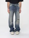Amiri Slashed Boot Cut Jean In Blue