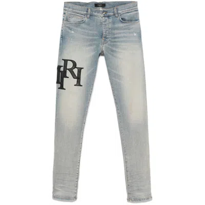 Amiri Staggered Logo Skinny Jeans For Men In Blue