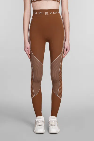 Amiri Logo-waistband Panelled Leggings In Brown