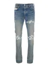 Amiri Light Blue Jeans With Ribbed Details On The Front And Logo Patch On The Rear In Denim Man In Blue