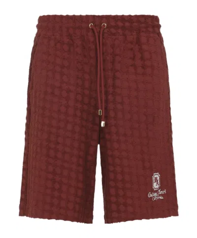 Amiri Chateau Textured Knee Length Bermuda Shorts In Red