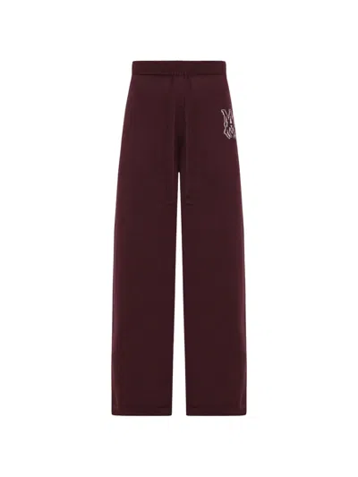 Amiri Logo Knit Trousers In Brown