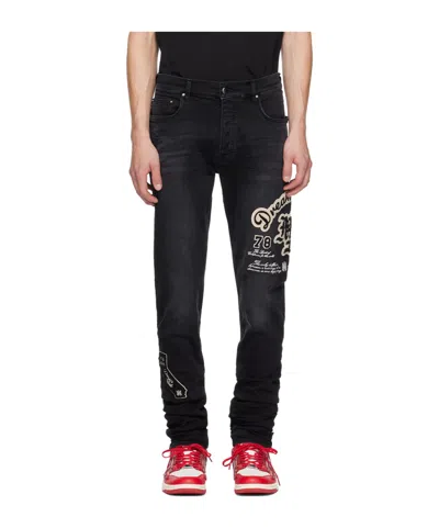AMIRI LOGO PATCH JEANS PANTS