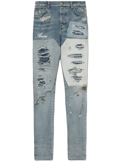 Amiri Skinny-fit Logo-embroidered Distressed Patchwork Jeans In Blue