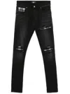 Amiri Slim Fit Distressed Trousers With Rivet Detailing In Black