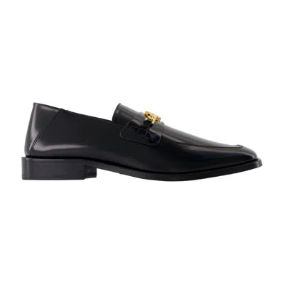 Amiri Polished Black Leather Loafers With Gold Chain Emblem