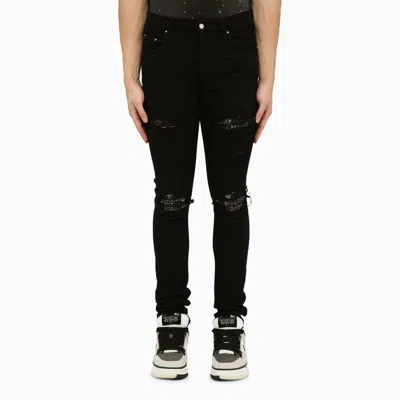 AMIRI MEN'S BLACK SKINNY JEANS WITH CAMOUFLAGE PATCHES FOR SS24