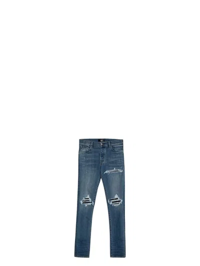 AMIRI MEN'S BLUE SKINNY JEANS WITH RIPS