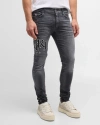 AMIRI MEN'S FADED SKINNY JEANS WITH STAGGERED LOGO
