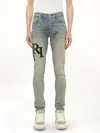 Amiri Men's Staggered Logo Skinny Jeans In Blue