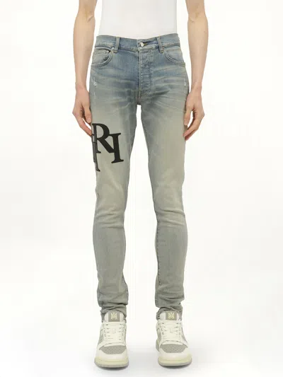 Amiri Men's Staggered Logo Skinny Jeans In Blue