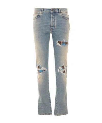 Amiri Mx1 Distressed Patch Jeans In Blue