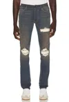 Amiri Distressed Ribbed-panel Jeans In Dark Dust