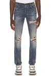 Amiri Distressed Patchwork Jeans In Blue
