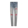 Amiri Mx1 Slim Fit Jeans With Distressed Red Accents