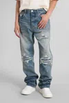 Amiri Men Blue Jeans With Ripped Details On The Front And Logo Patch On The Rear In Denim Man In Blue