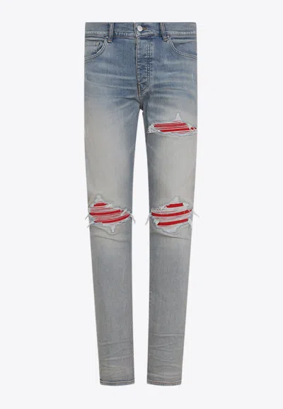 AMIRI MX1 RIPPED SKINNY JEANS