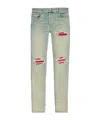 Amiri Mx1 Slim Fit Jeans With Distressed Red Accents In Gray