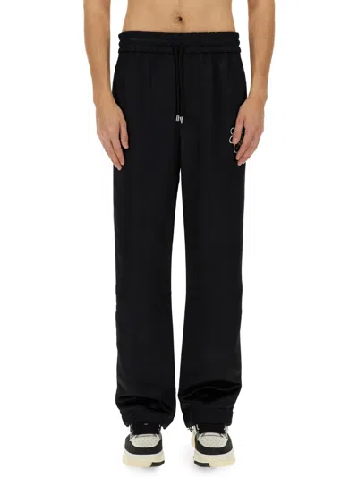 AMIRI PANTS WITH EMBROIDERY