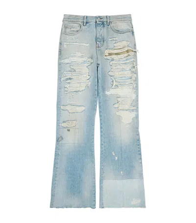 Amiri Repaired Bootcut Jeans In Blue