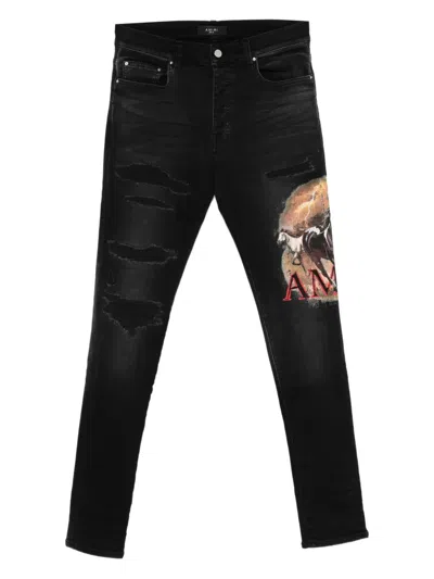 Amiri Ripped Graphic Jeans In Black
