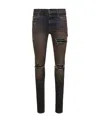 Amiri Ripped Jeans In Black